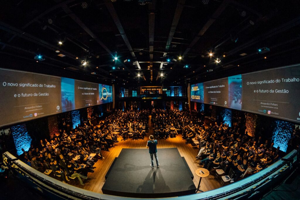 Celebrity keynote speaker cost for a corporate event on stage