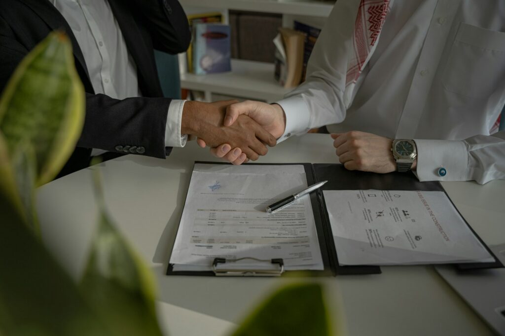 Negotiate celebrity appearance fee contract discussion handshake
