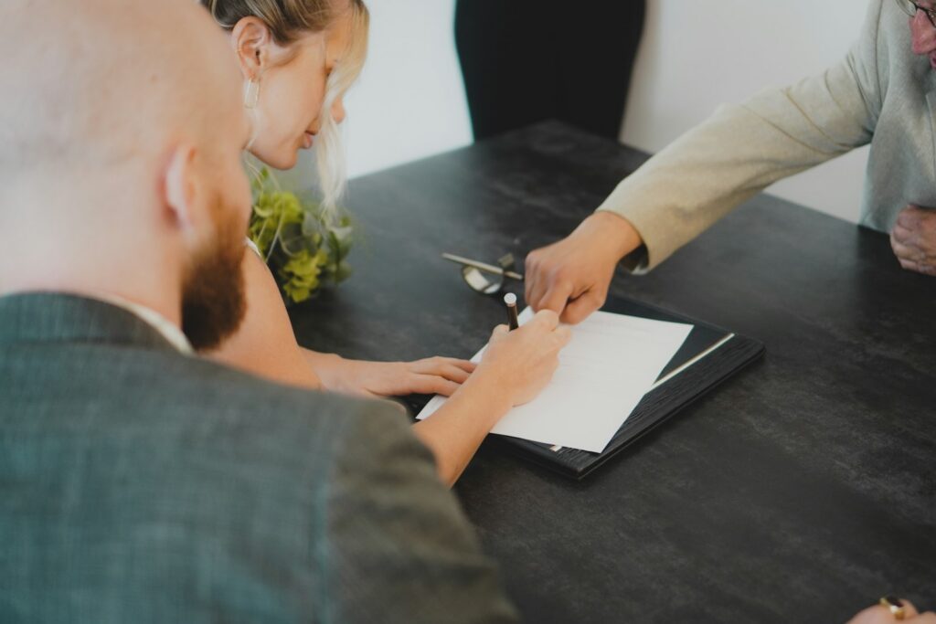 Reviewing a sponsorship proposal document at a desk